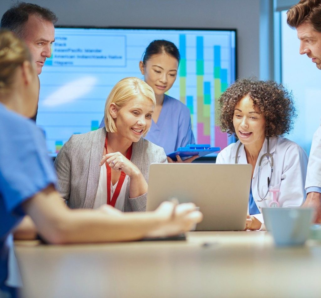 Image of a medical team looking at laptop